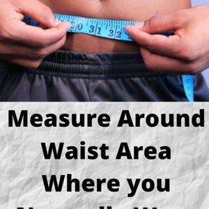 May include: A blue measuring tape is wrapped around a person's waist, with the numbers 30, 31, and 32 visible. The text below reads: "Measure Around Waist Area Where you Normally Wear Your Pants."