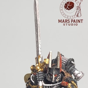 May include: Miniature figurine of a warrior in black armor with gold accents, holding a silver sword. The figure has red details and a purple cape. The base is dark gray, and the logo "MARS PAINT STUDIO" is visible.