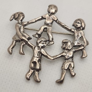 Sterling Children holding Hands Pin Marked and Signed