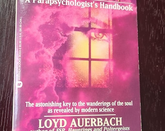 May include: A pink and purple book cover with the title "Reincarnation, Channeling and Possession: A Parapsychologist's Handbook" by Loyd Auerbach, author of "ESP, Hauntings and Poltergeists".