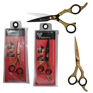 May include: Two pairs of Verstyle hair cutting scissors in clear plastic retail packaging and two loose pairs of scissors. The scissors feature ornate gold-toned handles with black finger rings and sharp, contrasting black or gold-toned blades.