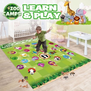 May include: A green and white play mat with animal illustrations and the text "ZOO CAMPS LEARN & PLAY". A young child is jumping on the mat. Toy animals are placed around the mat.
