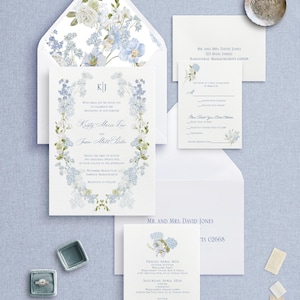 May include: A wedding invitation suite with a floral design featuring blue and white flowers. The invitation card has a floral border with the couple's names and wedding date. The RSVP card has a floral design and the text "The honor of a reply is requested by March 1st". The outer envelope has a floral design with blue and white flowers.