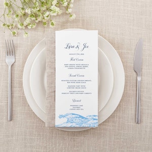 May include: A wedding menu card with a blue and white wave design. The menu lists the courses for the wedding reception: First Course, Second Course, and Dessert. The text on the card reads "Lyra & Joe, August 7th, 2001".