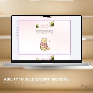 May include: A laptop screen shows a baby shower invitation design. The invitation includes a Winnie the Pooh illustration, the text "BOOKS FOR BABY", and other details. The laptop is on a light-coloured surface.