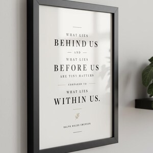 May include: Black framed print with the quote "What lies behind us and what lies before us are tiny matters compared to what lies within us." by Ralph Waldo Emerson. The text is in a clean, modern font on a white background.
