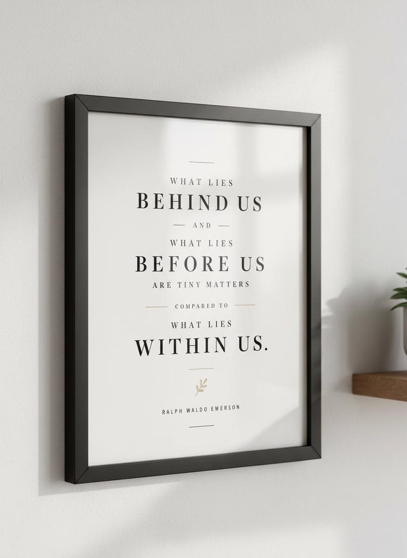 May include: A framed print with a black border, displaying the quote "WHAT LIES BEHIND US AND WHAT LIES BEFORE US ARE TINY MATTERS COMPARED TO WHAT LIES WITHIN US." by Ralph Waldo Emerson. The text is in black on a white background.