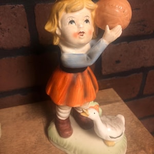 Vintage Girl with Basketball Goose Duck Figurine