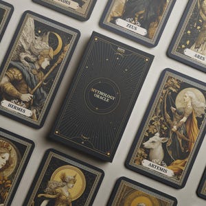 May include: A deck of Mythology Oracle cards with a black box featuring gold accents and the text "Mythology Oracle." The cards depict illustrations of Greek gods and goddesses, including Hermes and Artemis, in a vintage style.