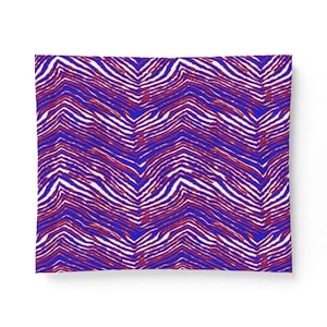 May include: A rectangular textile featuring a repeating pattern of wavy, horizontal lines in vibrant blue, deep red, and crisp white. The design consists of alternating organic stripes that create a dynamic, flowing visual texture across the surface.