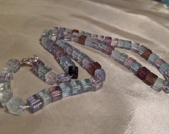 multi colored fluorite cube bead necklace on silver chain 21 inches long.