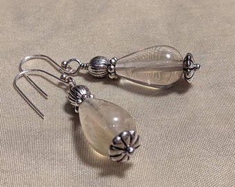 clear light yellow fluorite teardrop bead earrings with bali silver accents and sterling silver ear wires