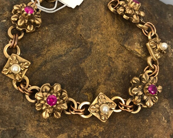 Historically inspired hand carved bronze bracelet with rubies