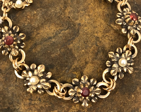 Historically inspired hand carved bronze bracelet with garnets