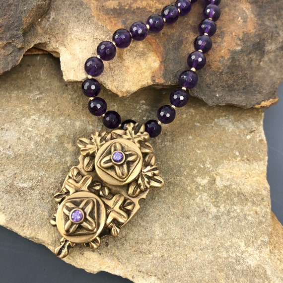 Historically inspired hand carved bronze pendant necklace with Amythest beads