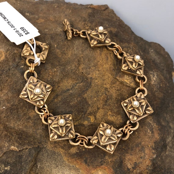 Historically inspired hand carved bronze bracelet with pearl accents