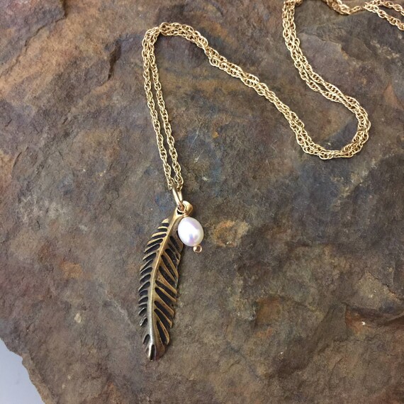 Small sculpted bronze feather