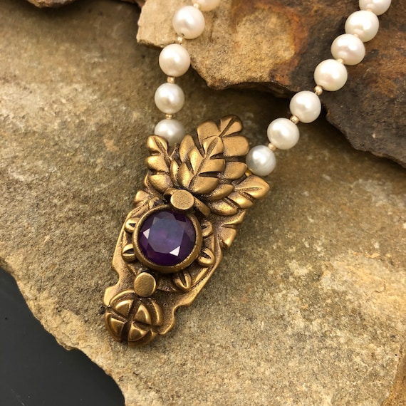 Historically inspired hand carved bronze pendant necklace with pearls