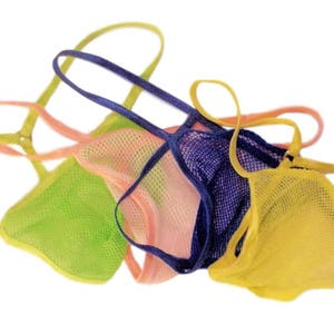 May include: Four mesh lingerie tops in different colors: yellow, green, pink, and blue. The tops are made of a soft, stretchy material and have adjustable straps.