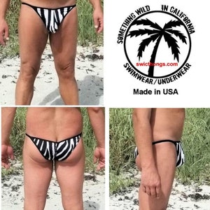 Könnte beinhalten: Schwarz-weißer Bikini-Slip mit Zebra-Muster und Schmetterlingsdesign. Der Bikini-Slip ist in den USA hergestellt.  SOMETHING WILD IN CALIFORNIA SWIMWEAR/UNDERWEAR swicthongs.com