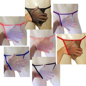 May include: Six pairs of sheer mesh underwear with different colored trim. The underwear is shown on a mannequin with a hand holding the fabric.
