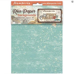 May include: A package of Stamperia Rice Paper Backgrounds, featuring a teal and white speckled design. The package includes 8 printed rice papers, A6 size, measuring 4.13 x 5.83 inches. The package also features the text "Furry Friends".
