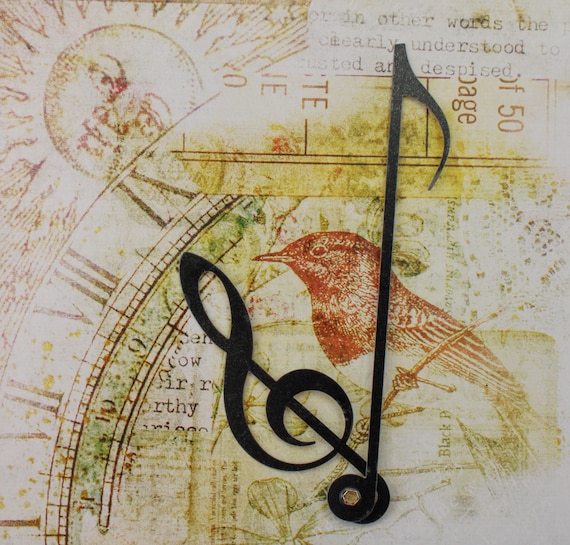 Manecillas de reloj con notas musicales vintage en negro