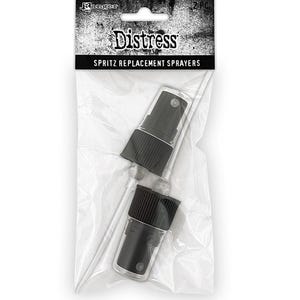 May include: Two black replacement sprayers for Distress Ink Spritz bottles. The sprayers are packaged in a clear plastic bag with a black and white label that reads "Distress Spritz Replacement Sprayers".