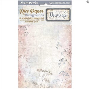 May include: A package of rice paper backgrounds, featuring a soft, textured design with floral accents. The package includes 8 A6 sheets, measuring 4.13 x 5.83 inches. The text on the package reads "Rice Paper Backgrounds" and "Dewdrops".