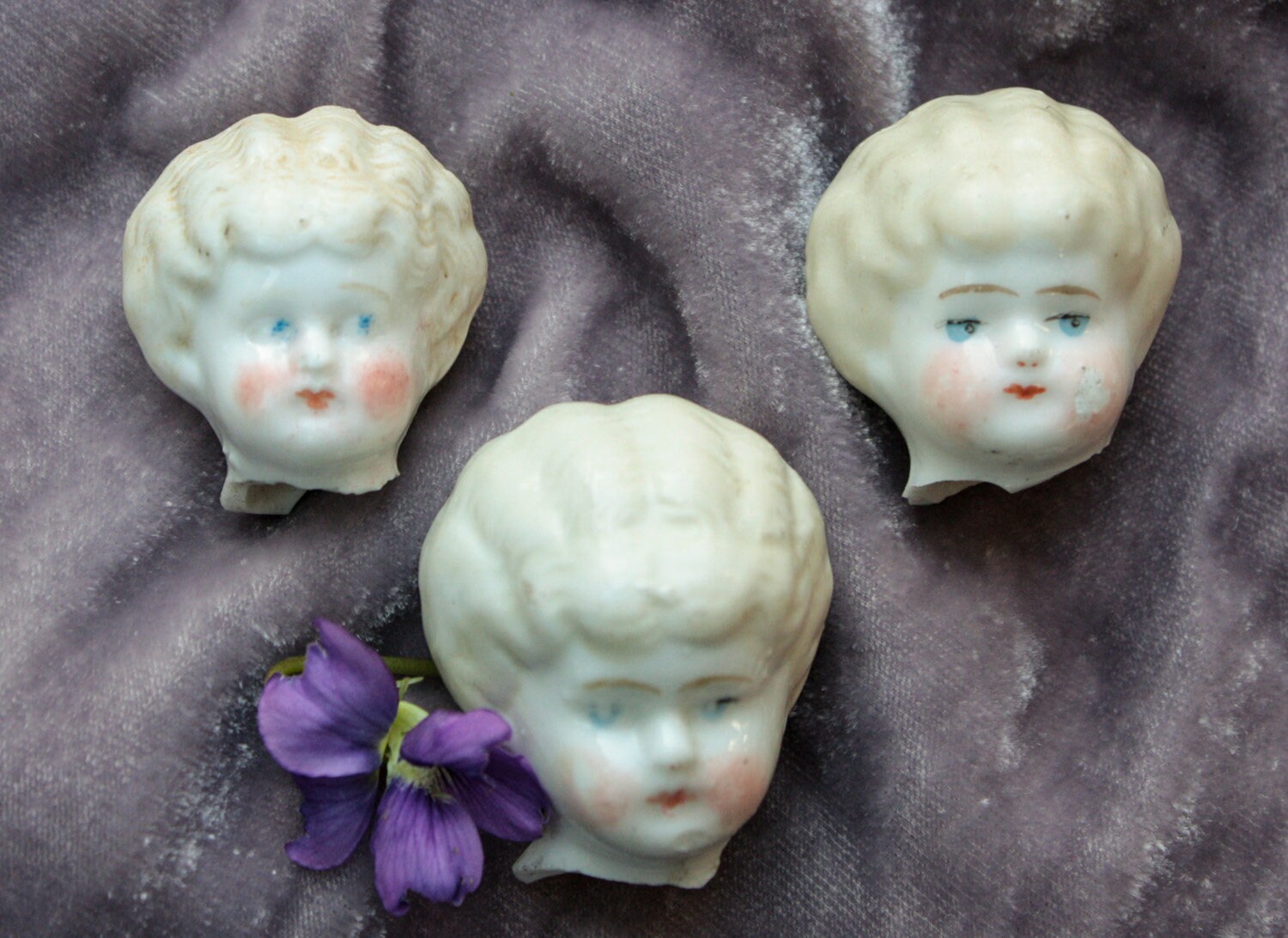 small porcelain doll heads