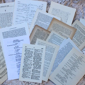 50 meertalige boekpagina's in het Hebreeuws, Chinees, Japans, Frans, Cyrillisch, Oudduits, Grieks, Pools en Spaans Kortstondig papier