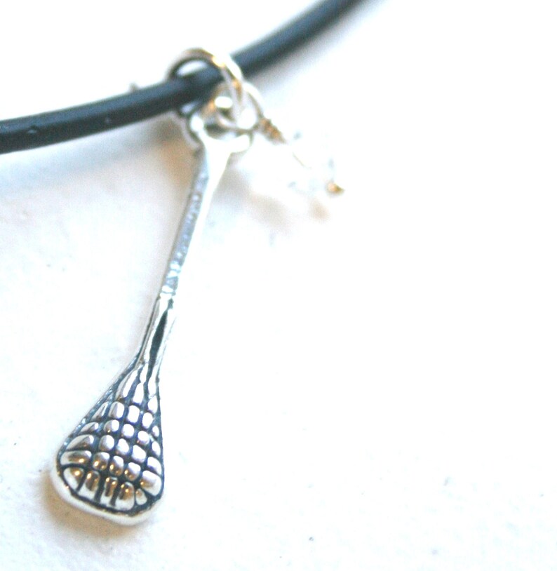 Sterling Silver Lacrosse Stick Pendant With Crystal Charm on Black