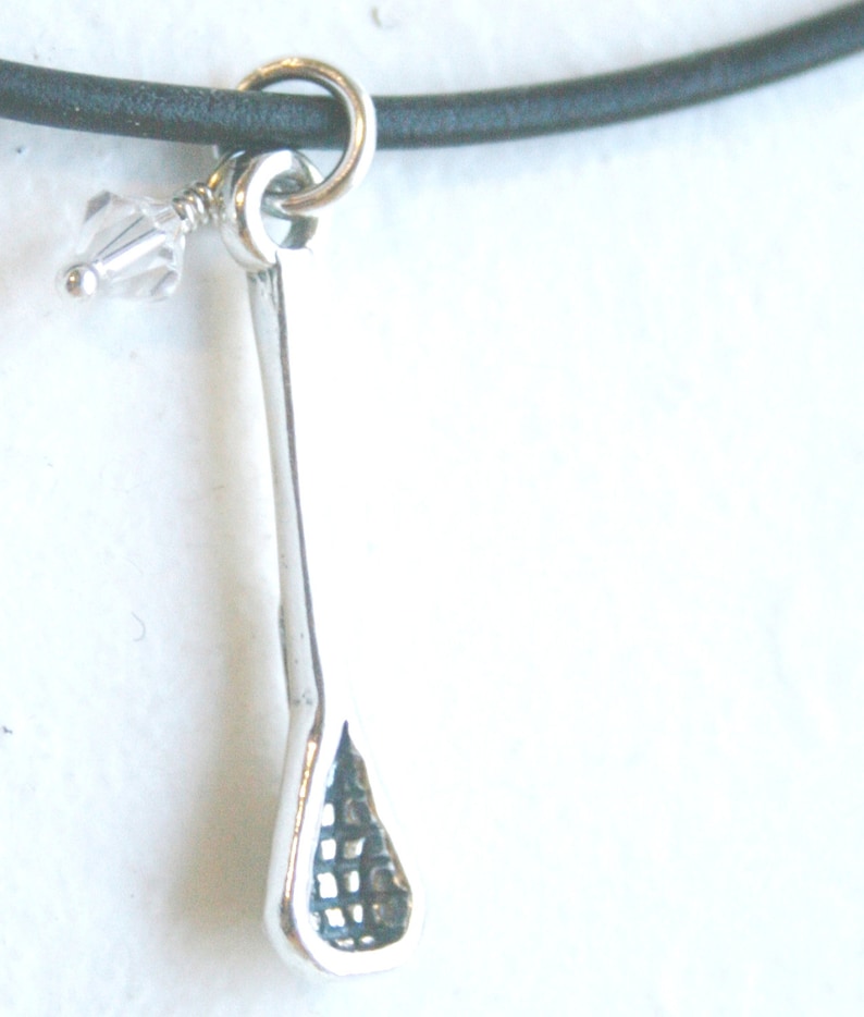 Sterling Silver Lacrosse Stick Pendant With Crystal Charm on Black
