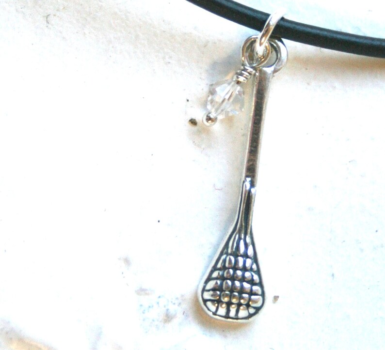Sterling Silver Lacrosse Stick Pendant With Crystal Charm on Black