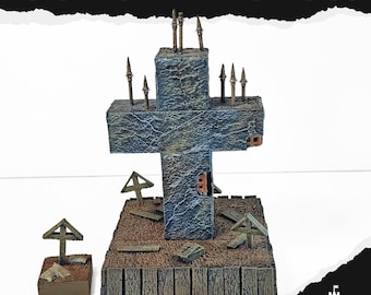 May include: A concrete cross sculpture with the text "CONCRETE CROSS" at the top. The cross is gray and weathered, with small metal spikes on top. The base features miniature tombstones and a wooden fence.