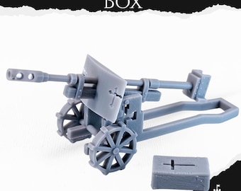May include: A gray miniature artillery cannon with spoked wheels and a small ammunition box. The text "ARTILLERY AND AMMO BOX" is at the top of the image. The cannon has a detailed design, including a barrel and aiming mechanism.