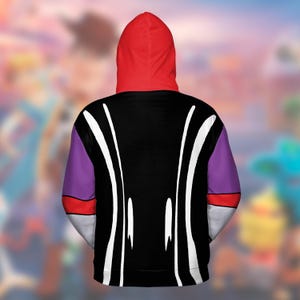May include: A hooded sweatshirt with a red hood, black torso, and purple sleeves. White curved lines run down the back of the black torso. The sleeves have red and white accents. The background is blurred.