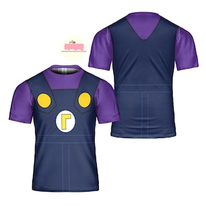 May include: A short-sleeved t-shirt featuring a navy blue overall design with yellow circles and a white circle with a yellow "L" on the front. The shirt has purple sleeves and a purple neckline. The back of the shirt is navy blue with a purple neckline.