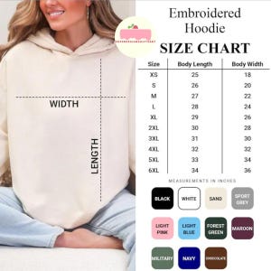 May include: A beige embroidered hoodie with a size chart. The chart lists body length and width measurements in inches for sizes XS to 6XL. Colour options include black, white, sand, sport grey, light pink, light blue, forest green, maroon, military, navy, and chocolate.