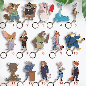 May include: A collection of cartoon character keychains featuring various animals. The keychains are colorful and include a beaver, raccoon, elephant, snake, gazelle, fox, horse, sloth, fox and rabbit, leopard, bison, lion, and rabbit.