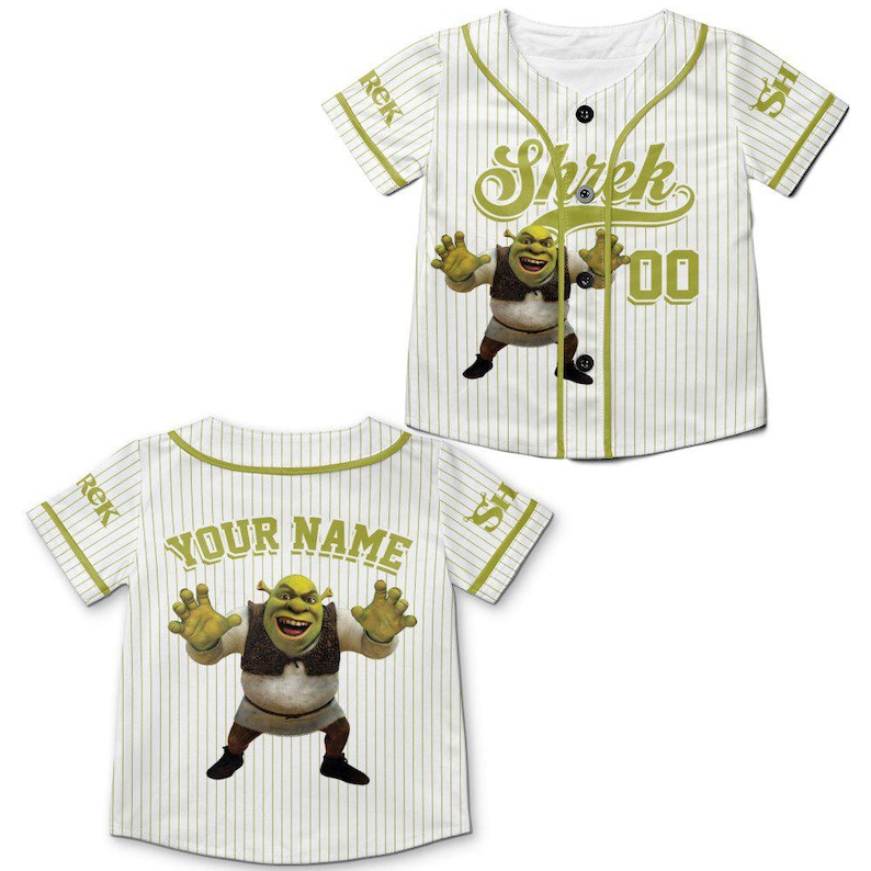May include: White baseball jersey with green pinstripes and accents. Features a cartoon image of Shrek and the word "Shrek" in green script. The back of the jersey has the words "YOUR NAME" in green.