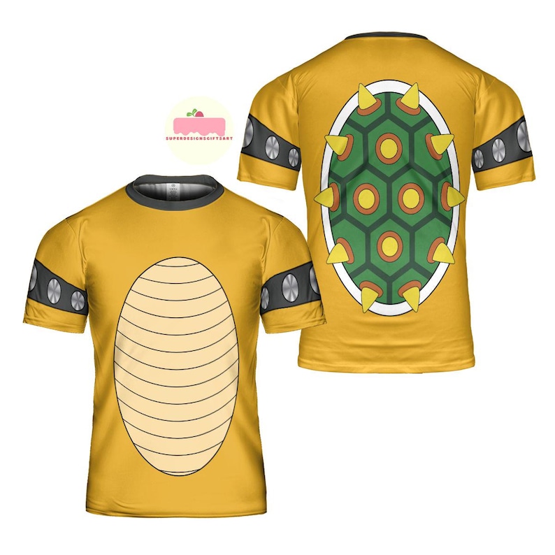 May include: Yellow t-shirt featuring a Bowser shell design. The front of the shirt has a tan oval pattern, while the back displays a green and yellow shell with spikes. The sleeves have black and silver accents. The shirt is short-sleeved.