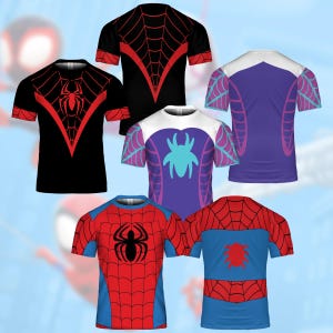 May include: Collection of short-sleeved t-shirts featuring superhero-themed designs. The shirts display vibrant colors, including red, black, blue, and purple, with spiderweb and spider graphics. The designs vary, showcasing different superhero styles.