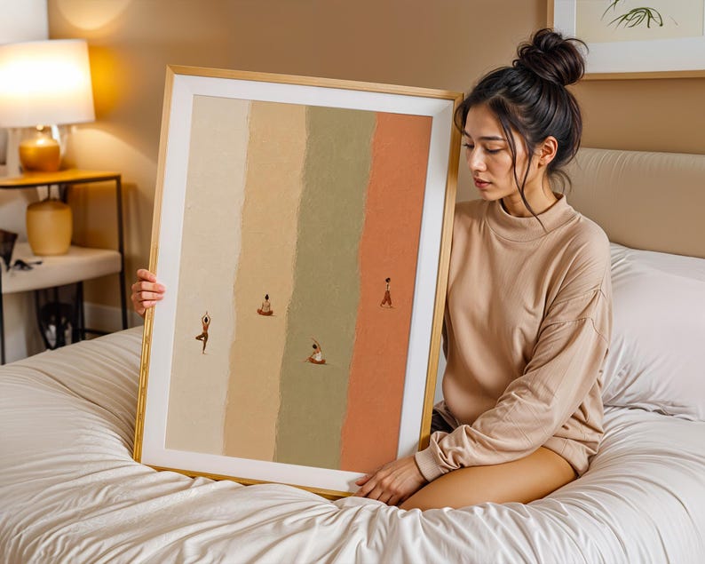 May include: A framed vertical wall art print featuring four distinct vertical color panels in shades of cream, beige, sage green, and terracotta. Small, minimalist figures are depicted in various yoga poses across the textured background.