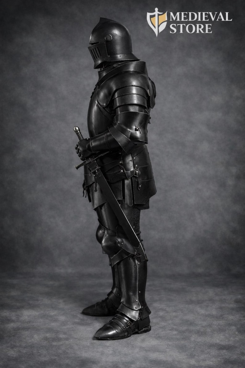 May include: A full suit of black medieval armor, including a helmet, chest plate, arm and leg protection, and boots. The armor is highly detailed and appears to be made of metal. A sword is held at the ready. The Medieval Store logo is in the upper right corner.