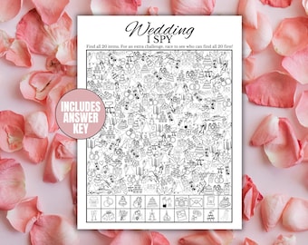 May include: Black and white "Wedding I Spy" game with various wedding-themed illustrations. Includes an answer key. The game is surrounded by pink rose petals.