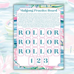 May include: A Mahjong Practice Board with a colorful floral and boat design. The board features spaces for tiles and instructions for solo play. The word "ROLLOR" is printed on the board, along with the numbers "123".