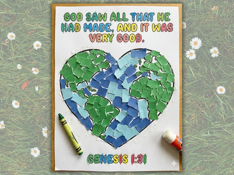 May include: A colorful artwork featuring a heart-shaped collage of green and blue paper pieces, resembling a map. The text "GOD SAW ALL THAT HE HAD MADE, AND IT WAS VERY GOOD" is written above the heart. The text "GENESIS 1:31" is written below the heart. A green crayon and glue stick are on the artwork.