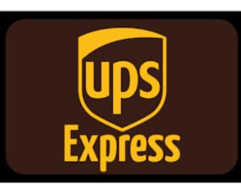 May include: A rectangular sign with a dark brown background and a black border. The logo features a yellow shield containing the lowercase letters ups in a bold font, with the word Express written in yellow capital letters below it.