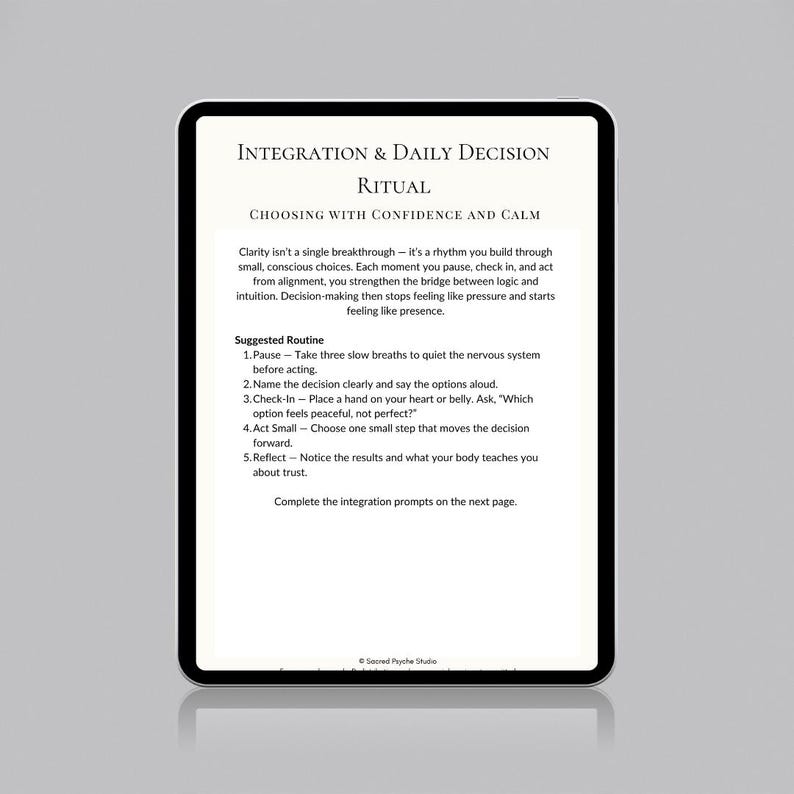 May include: A digital tablet displaying a white page with black text titled "INTEGRATION & DAILY DECISION RITUAL". The text provides guidance on making decisions with confidence and calm, including a suggested routine. The tablet has a black border.